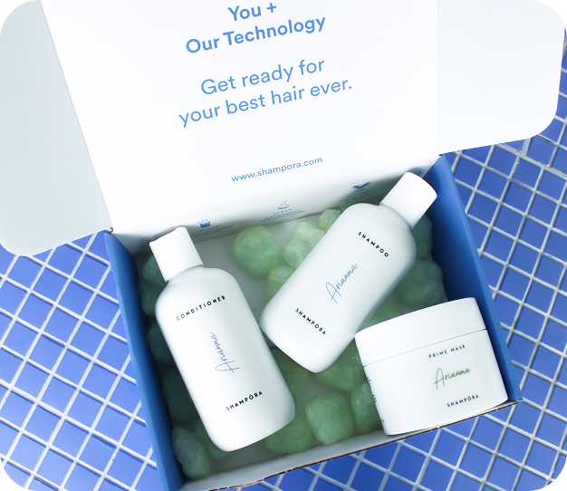 Hair Box Shampora aperta con i tre prodotti full-size della routine personalizzata